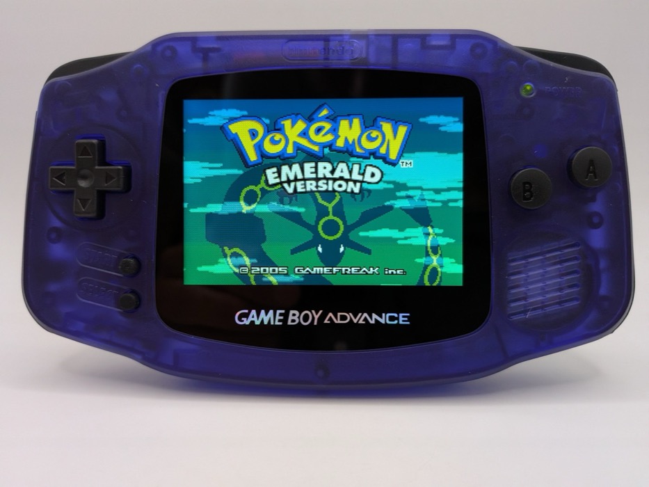 Clear blue Game Boy Advance with backlit IPS screen glowing